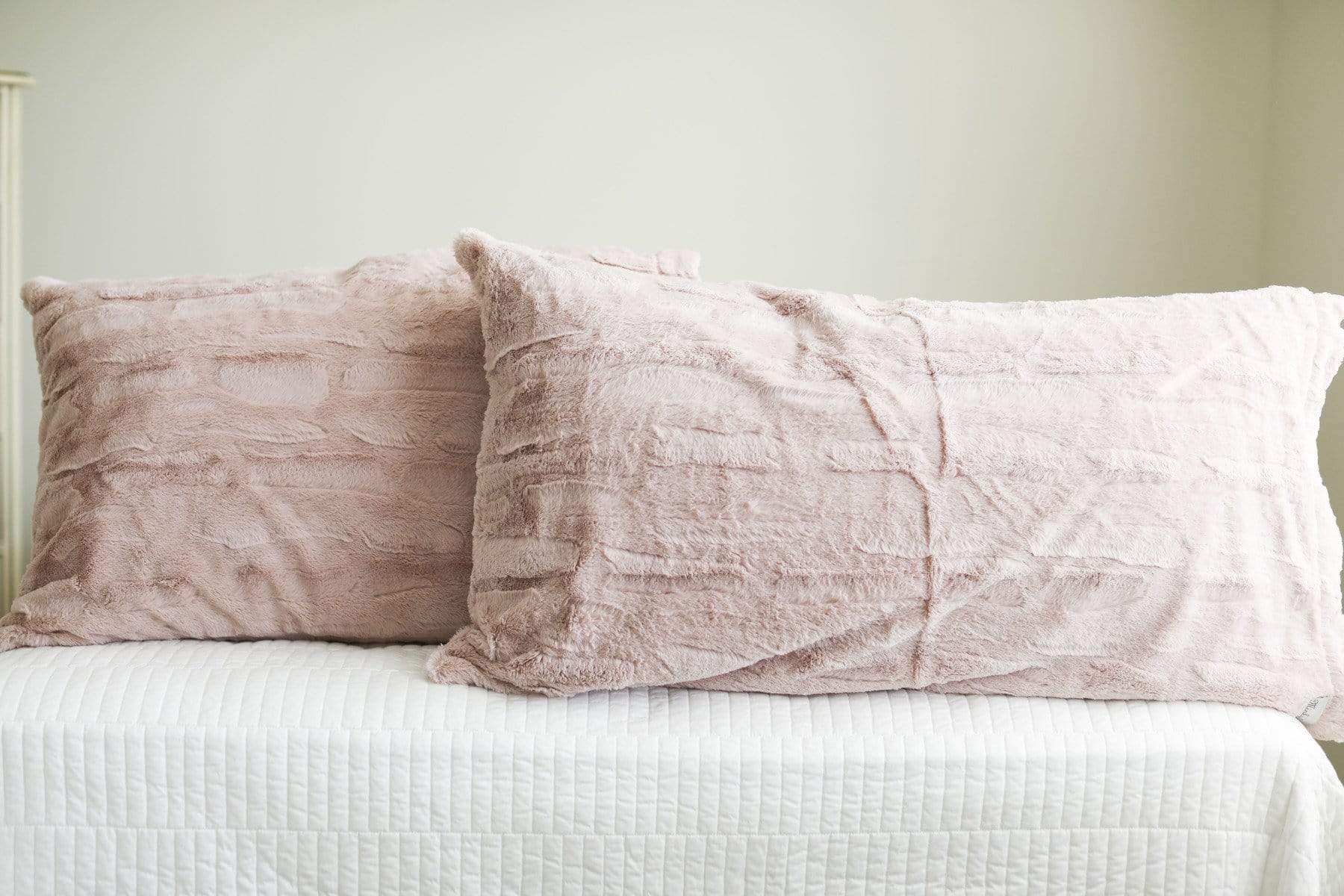 Two plush and cozy blush pillows by Minky Couture. 